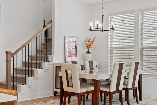 1305 Crescent Ln, Georgetown, TX 78633 - dining room featuring a chandelier, stairs, and wood finished floors