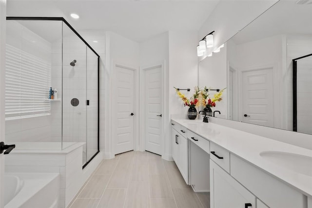 1305 Crescent Ln, Georgetown, TX 78633 - bathroom featuring a shower stall, double vanity, a bath, and recessed lighting