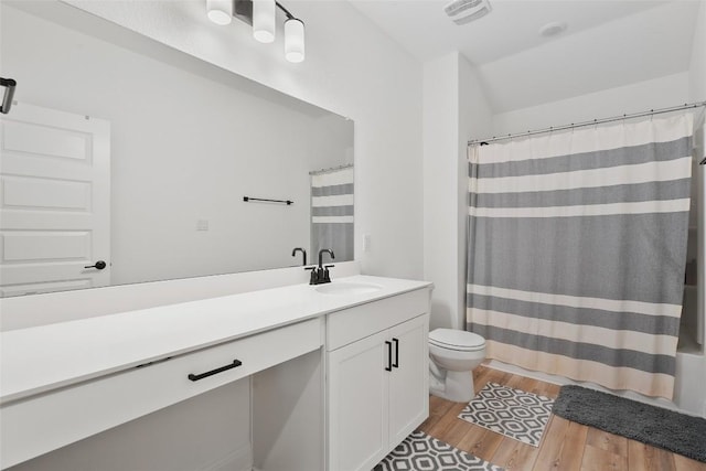 1305 Crescent Ln, Georgetown, TX 78633 - bathroom featuring vanity, wood finished floors, and toilet