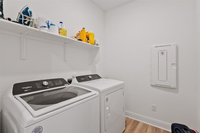 1305 Crescent Ln, Georgetown, TX 78633 - laundry area featuring independent washer and dryer, light wood finished floors, and baseboards