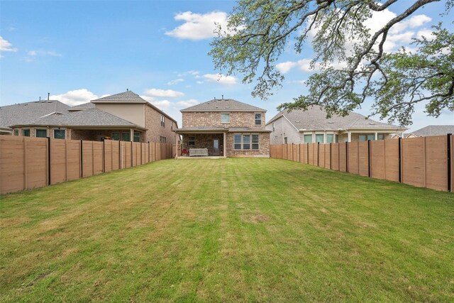 1305 Crescent Ln, Georgetown, TX 78633 - back of property featuring a fenced backyard and brick siding