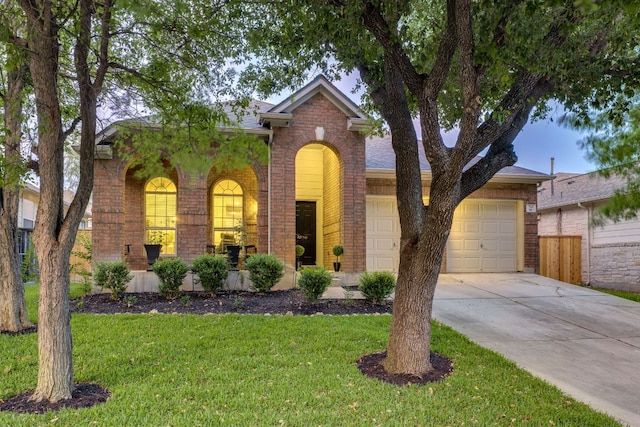 745 Bent Wood Pl, Round Rock, TX 78665 - traditional home featuring brick siding, driveway, and a garage
