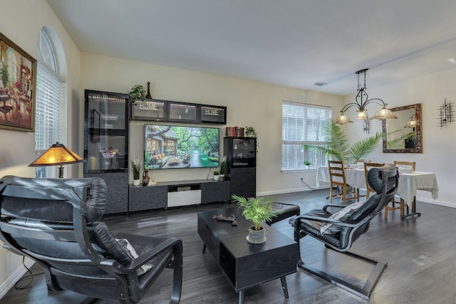 745 Bent Wood Pl, Round Rock, TX 78665 - living room with dark wood-style flooring, baseboards, and a chandelier