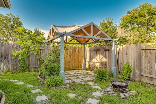 745 Bent Wood Pl, Round Rock, TX 78665 - fenced backyard featuring a fire pit and a gazebo