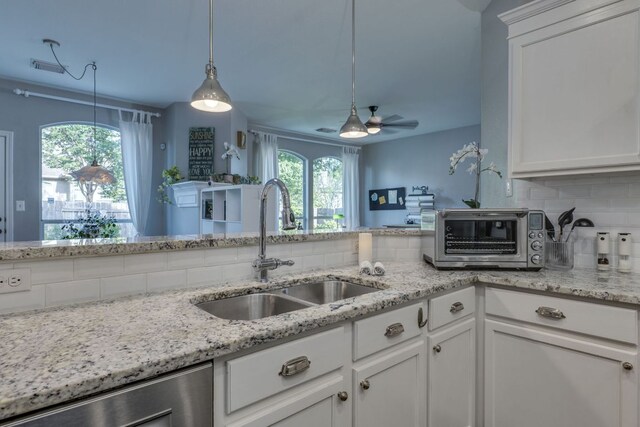 745 Bent Wood Pl, Round Rock, TX 78665 - kitchen featuring a sink, tasteful backsplash, dishwasher, and white cabinetry
