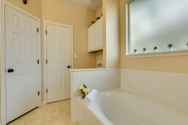 745 Bent Wood Pl, Round Rock, TX 78665 - full bath with a garden tub and tile patterned floors