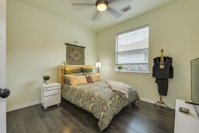 745 Bent Wood Pl, Round Rock, TX 78665 - bedroom with dark wood-style floors, baseboards, and ceiling fan