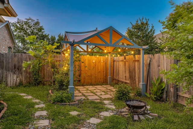745 Bent Wood Pl, Round Rock, TX 78665 - fenced backyard featuring a fire pit