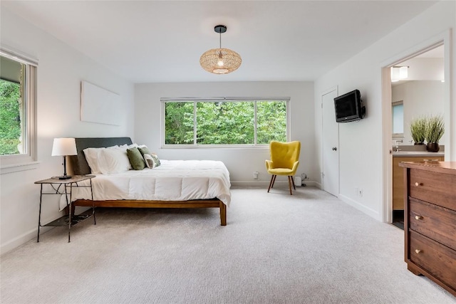 2306 Loyola Ln, Austin, TX 78723 - carpeted bedroom featuring baseboards and connected bathroom