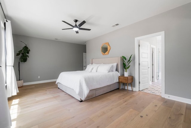 13420 Trail Driver St, Austin, TX 78737 - bedroom with light wood finished floors and ceiling fan