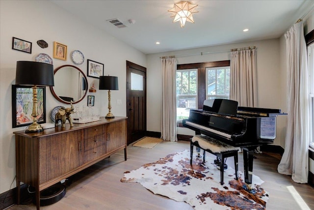 2504 Willow St Unit A, Austin, TX 78702 - foyer entrance with wood finished floors, recessed lighting, and baseboards