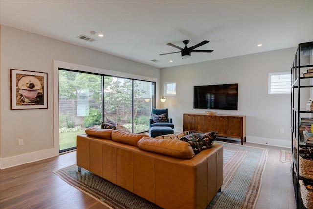 2504 Willow St Unit A, Austin, TX 78702 - living room featuring baseboards, wood finished floors, a ceiling fan, and recessed lighting