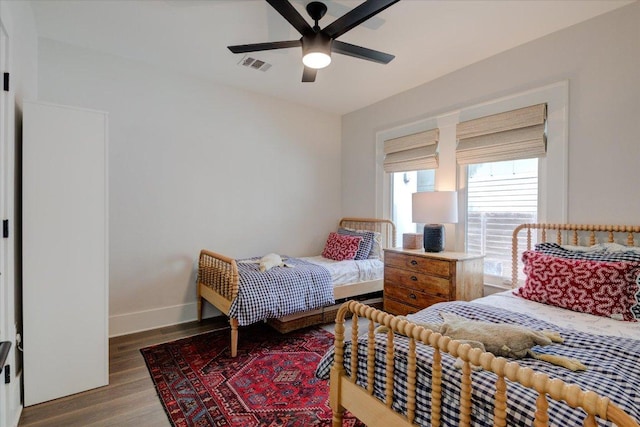2504 Willow St Unit A, Austin, TX 78702 - bedroom featuring wood finished floors, baseboards, and a ceiling fan
