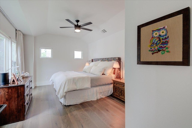 2504 Willow St Unit A, Austin, TX 78702 - bedroom with wood finished floors, lofted ceiling, a ceiling fan, and baseboards