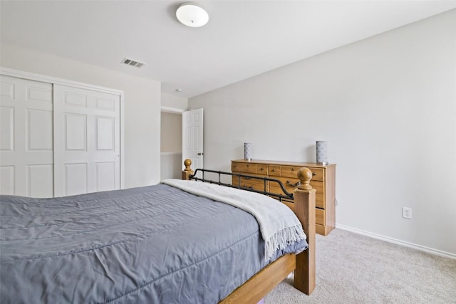 223 Woodlake Dr, Georgetown, TX 78633 - bedroom with carpet floors, a closet, and baseboards