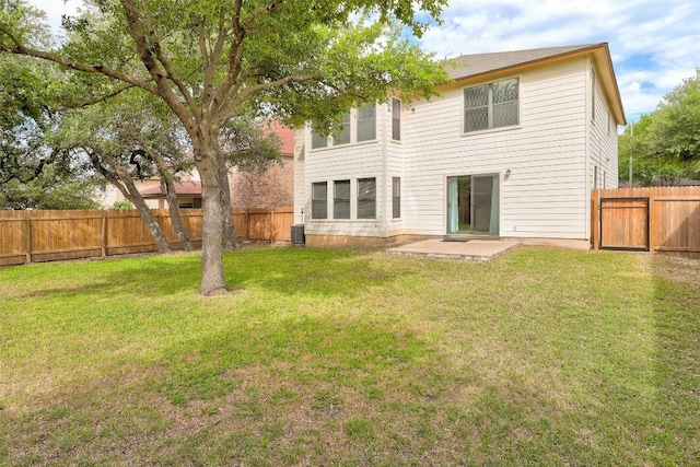 223 Woodlake Dr, Georgetown, TX 78633 - back of property featuring a patio area and central AC unit