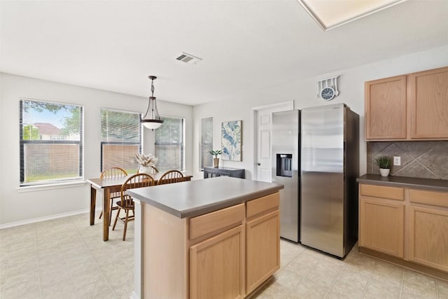 223 Woodlake Dr, Georgetown, TX 78633 - kitchen with stainless steel refrigerator with ice dispenser, decorative backsplash, pendant lighting, and light brown cabinetry