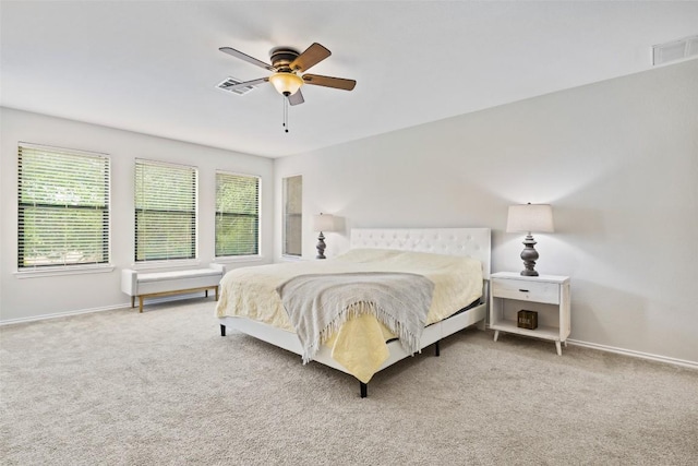 223 Woodlake Dr, Georgetown, TX 78633 - bedroom featuring multiple windows, carpet flooring, and baseboards