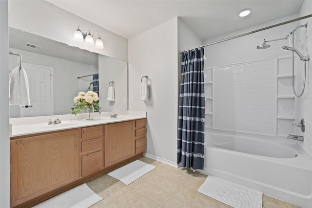 223 Woodlake Dr, Georgetown, TX 78633 - full bath featuring shower / tub combo, double vanity, and tile patterned flooring