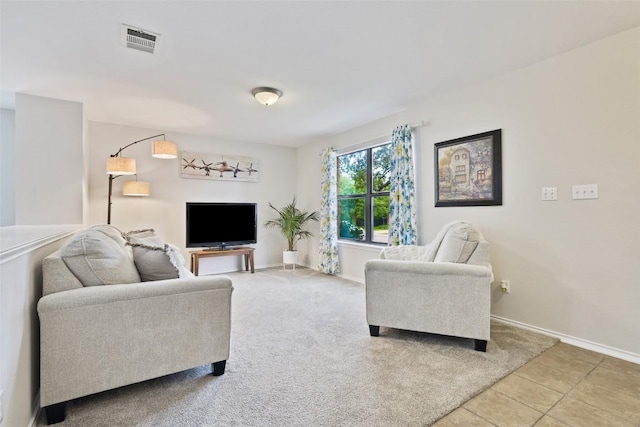 223 Woodlake Dr, Georgetown, TX 78633 - living area with baseboards, light tile patterned flooring, and light carpet