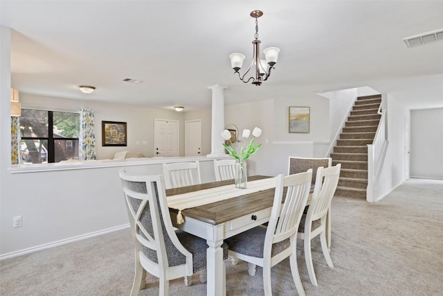 223 Woodlake Dr, Georgetown, TX 78633 - dining space featuring light carpet, stairs, a chandelier, and baseboards
