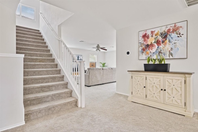 223 Woodlake Dr, Georgetown, TX 78633 - stairway with carpet, a ceiling fan, and baseboards
