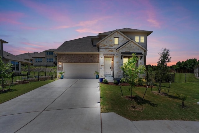 1908 Cabrera Dr, Leander, TX 78641 - view of front facade featuring stone siding, a garage, and concrete driveway