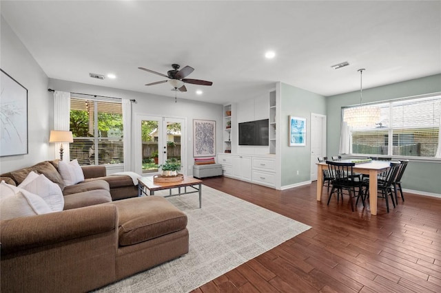 5929 Mesa Verde Cir, Austin, TX 78749 - living area with ceiling fan, a chandelier, healthy amount of natural light, dark wood-style floors, and recessed lighting