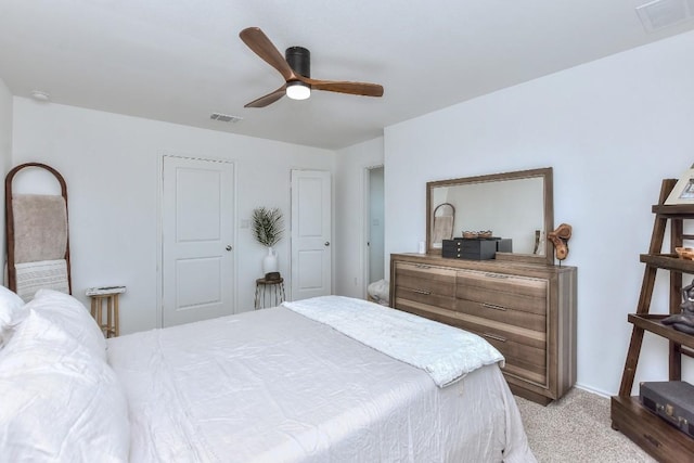 159 Andross Ln, Bastrop, TX 78602 - bedroom with light colored carpet, a ceiling fan, and baseboards
