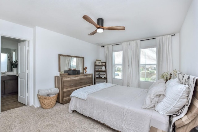 159 Andross Ln, Bastrop, TX 78602 - bedroom with carpet, ceiling fan, and connected bathroom