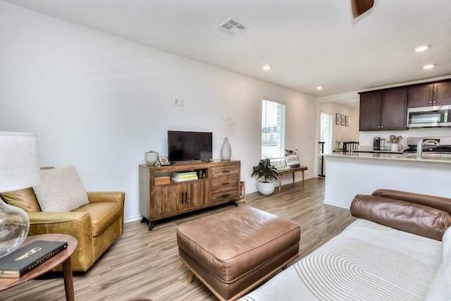 159 Andross Ln, Bastrop, TX 78602 - living room with light wood-type flooring, recessed lighting, and baseboards