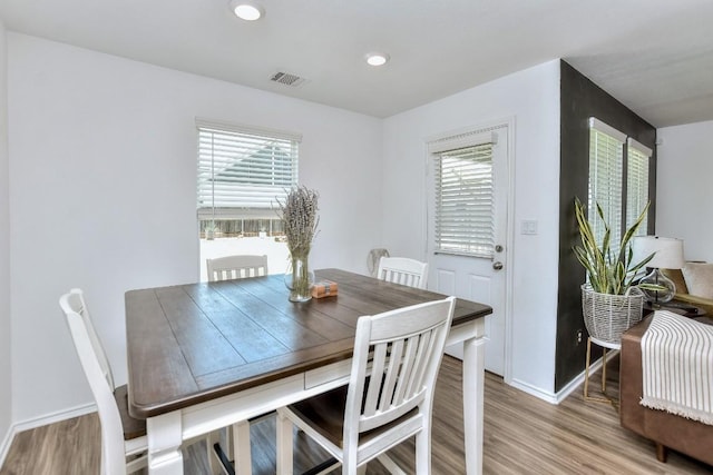 159 Andross Ln, Bastrop, TX 78602 - dining area with light wood finished floors, plenty of natural light, baseboards, and recessed lighting