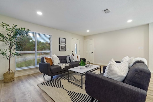 4507 Elana Ct, Austin, TX 78741 - living room featuring wood finished floors, recessed lighting, and baseboards