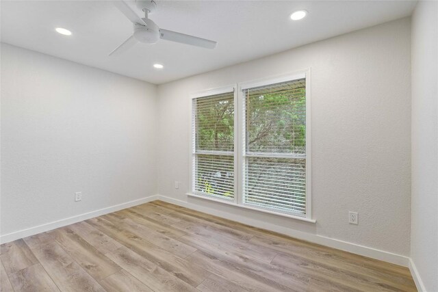 4507 Elana Ct, Austin, TX 78741 - unfurnished room with wood finished floors, recessed lighting, ceiling fan, and baseboards
