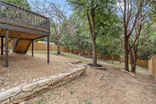 4507 Elana Ct, Austin, TX 78741 - fenced backyard with a wooden deck and stairway