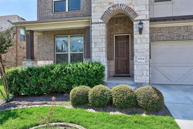 6724 Leonardo Dr, Round Rock, TX 78665 - property entrance featuring brick siding, concrete driveway, and stone siding