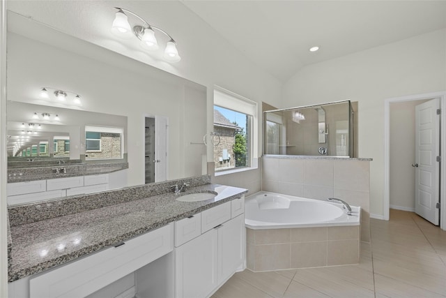 6724 Leonardo Dr, Round Rock, TX 78665 - bathroom featuring a bath, tile patterned floors, vanity, a stall shower, and lofted ceiling