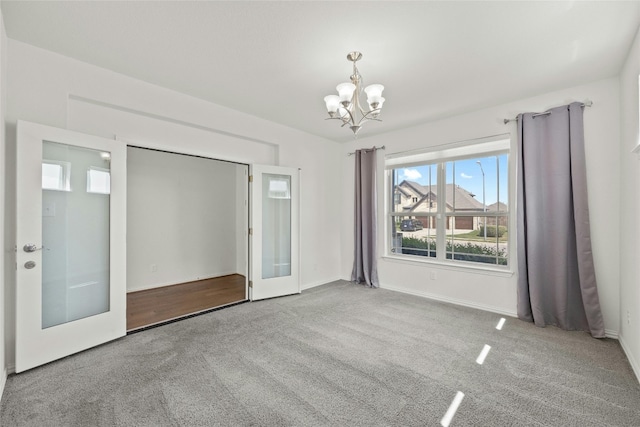6724 Leonardo Dr, Round Rock, TX 78665 - unfurnished room featuring a chandelier, carpet, and baseboards