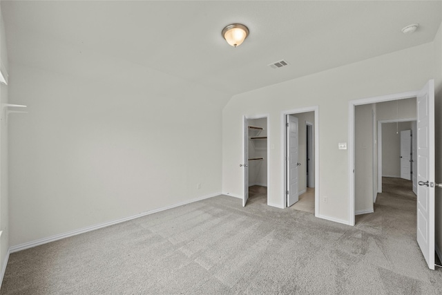 6724 Leonardo Dr, Round Rock, TX 78665 - unfurnished bedroom featuring light carpet, baseboards, a spacious closet, and a closet