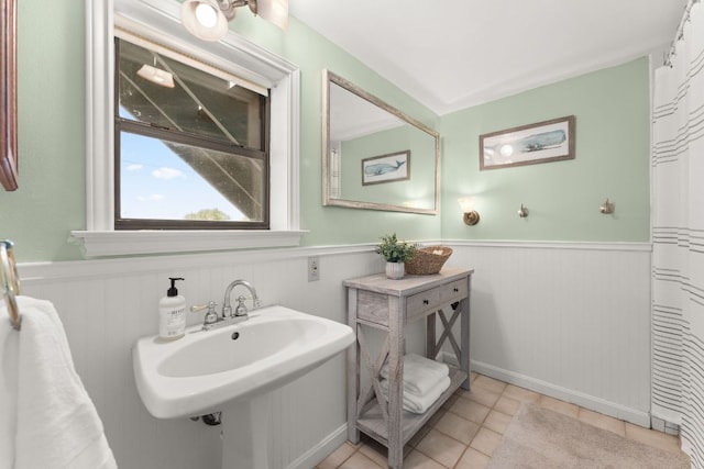 744 Jim Bowie Dr, Spicewood, TX 78669 - bathroom featuring wainscoting and tile patterned floors