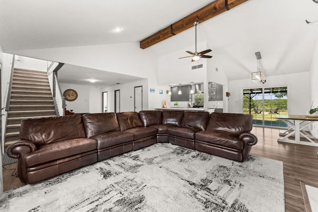 744 Jim Bowie Dr, Spicewood, TX 78669 - living room with a ceiling fan, wood finished floors, high vaulted ceiling, beamed ceiling, and stairway