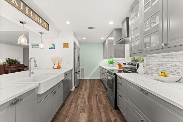 744 Jim Bowie Dr, Spicewood, TX 78669 - kitchen featuring stainless steel appliances, gray cabinetry, wall chimney range hood, a sink, and recessed lighting