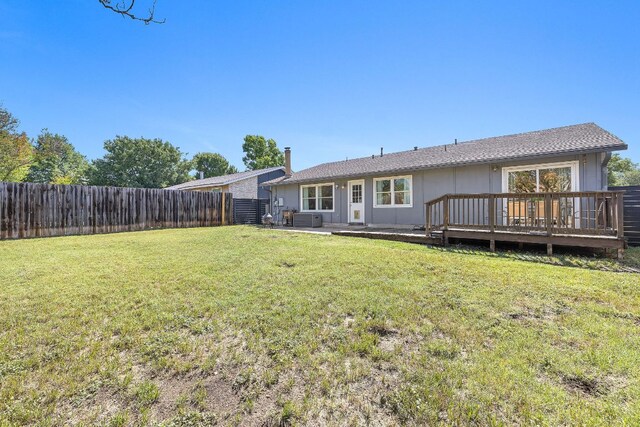 11200 Bending Bough Trl, Austin, TX 78758 - back of property with a wooden deck and central air condition unit