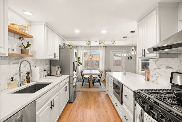 11200 Bending Bough Trl, Austin, TX 78758 - kitchen featuring appliances with stainless steel finishes, open shelves, a sink, white cabinets, and recessed lighting