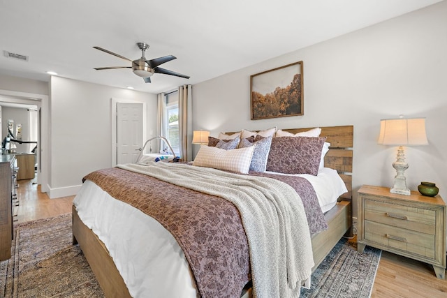 11200 Bending Bough Trl, Austin, TX 78758 - bedroom with light wood-style floors, ceiling fan, baseboards, and a closet