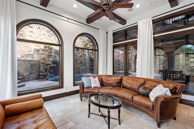 604 Logans Ln, Austin, TX 78746 - living room featuring stone tile flooring, recessed lighting, ceiling fan, and beam ceiling
