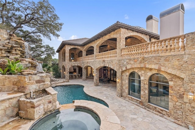 604 Logans Ln, Austin, TX 78746 - view of swimming pool with a patio and a pool with connected hot tub