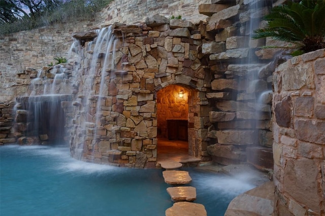 604 Logans Ln, Austin, TX 78746 - wine room featuring arched walkways