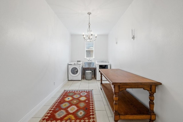 310 Lauren Trl, Cedar Park, TX 78613 - laundry area featuring washer / dryer, a chandelier, light tile patterned floors, and baseboards