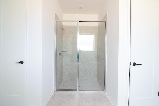 5337 Olimpico Way, Leander, TX 78641 - full bath with a stall shower, baseboards, and tile patterned flooring